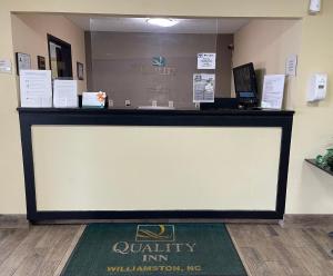 a large display screen in a waiting room at Quality Inn Williamston in Williamston