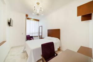 Postel nebo postele na pokoji v ubytování Violeta Hotel Boutique
