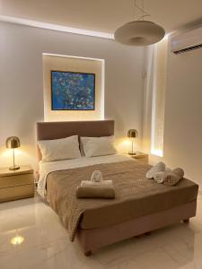 Posteľ alebo postele v izbe v ubytovaní Agios Nikolaos Beach Villas + 32 fotografií