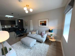 a living room with a couch and a table at Sutcliffe House in Dublin