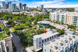an aerial view of a city with a red arrow on a building at Pretty Rola 201 Luxury 1B1B w King Bed at Downtown Fort Lauderdale in Fort Lauderdale