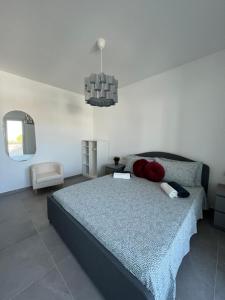 a bedroom with a large bed and a mirror at The Plus #3 HOWME in Bari