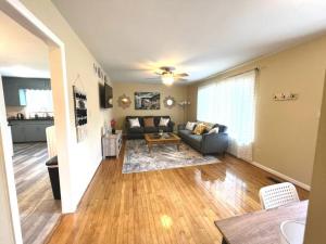 a living room with a couch and a table at *Comfortable Townhome * King Beds * Long Term* in Cary