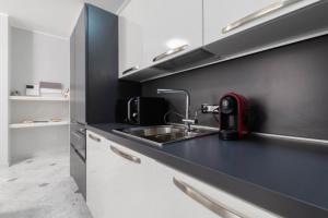 A kitchen or kitchenette at Appartamento Giulia - Alassio