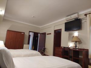 A bed or beds in a room at Lima Wasi Hotel Miraflores
