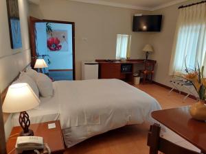 A bed or beds in a room at Lima Wasi Hotel Miraflores