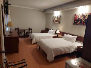A bed or beds in a room at Lima Wasi Hotel Miraflores