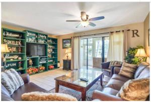 a living room with a couch and a table at New listing!!! 4 min walk to the beach! in Destin