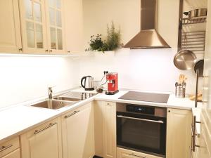 a kitchen with a sink and a stove top oven at Izzy - 5 min walk from the main square in Zagreb