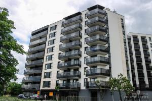 a building with balconies on the side of it at D Apartments Centrum Prowiantowa in Białystok