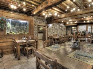 a dining room with wooden tables and chairs at La Locanda di Giulia in Arezzo