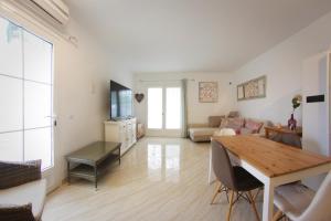a living room with a table and a couch at Apartamento Playa Blanca in Playa Blanca