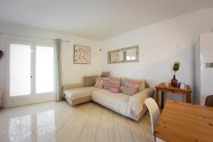 a living room with a couch and a table at Apartamento Playa Blanca in Playa Blanca