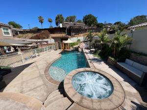 a swimming pool in a yard with a patio at San Diego Luxury Oasis in Spring Valley