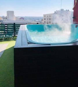 a swimming pool on the roof of a building at Plaza in Termas de Río Hondo