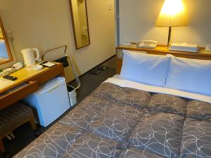 Postel nebo postele na pokoji v ubytování Az Inn Fukui (Ace Inn Fukui)
