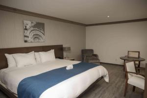 מיטה או מיטות בחדר ב-Suites Obelisk