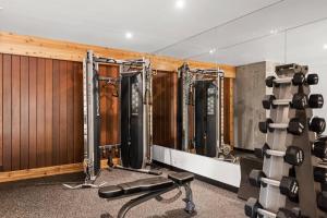 a fitness room with a row of gym equipment at Shadowbrook 103 in Snowmass Village