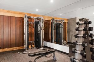a fitness room with a row of gym equipment at Shadowbrook 304 in Snowmass Village