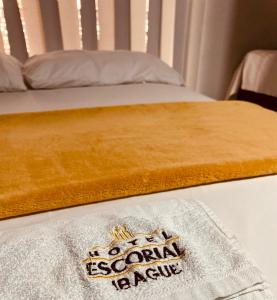Postel nebo postele na pokoji v ubytování Hotel Escorial Ibagué