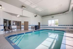a large swimming pool in a building at Best Western Plus Red Deer Inn & Suite in Red Deer