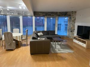 a living room with a couch and a table at Spacious apartment on Main Street (City Center) in Kazanlŭk