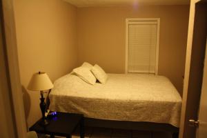 A bed or beds in a room at Key West Style Historic Home in Coconut Grove Florida The Yellow House