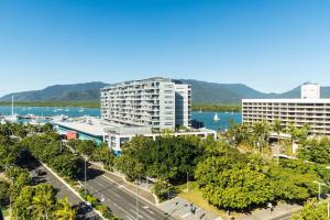 an aerial view of a city with trees and buildings at Pacific Hotel Cairns in Cairns