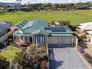 an aerial view of a house with solar panels on the roof at Ti Na Mara 20 Resolute Avenue Normanville in Normanville