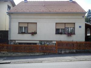 a house with a wooden fence in front of it at Apartments with WiFi Daruvar, Bjelovarska - 17093 in Daruvar