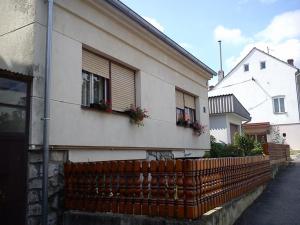 a house with two windows and a fence at Apartments with WiFi Daruvar, Bjelovarska - 17093 in Daruvar