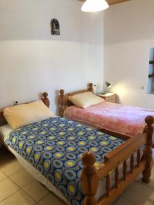 a bedroom with two beds in a room at Apartments by the sea Susak, Losinj - 17302 in Susak