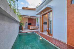 a swimming pool in the backyard of a house at Villa Casa Natura 15 - 2 BRV with private pool 15 mins to Ubud in Ubud