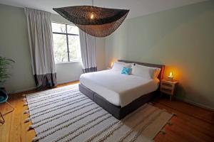 Tempat tidur dalam kamar di FABULOSO APARTAMENTO 2BR / 2B POLANCO 403