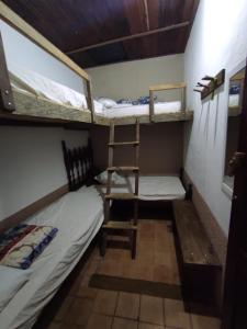 Cama ou camas em um quarto em Hostel Mucugê