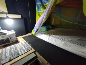 Cama ou camas em um quarto em Hostel Mucugê