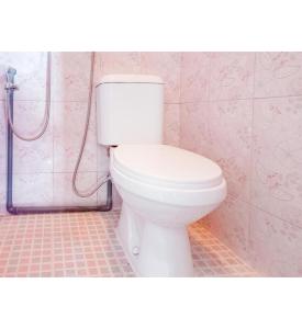 a bathroom with a white toilet and a shower at Hotel Gerung 2 near Luwes Mall Nganjuk Mitra RedDoorz in Nganjuk