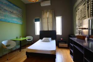 Postel nebo postele na pokoji v ubytování Barrio Antiguo Hostel HK