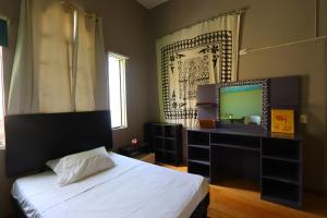 Postel nebo postele na pokoji v ubytování Barrio Antiguo Hostel HK