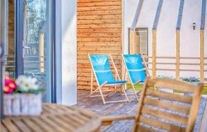 two chairs and a table on a patio at Beautiful Home In Nowecin With Kitchen in Nowecin
