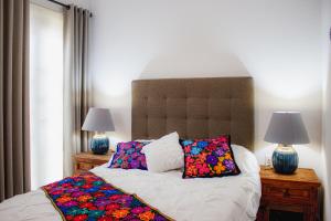 Ένα ή περισσότερα κρεβάτια σε δωμάτιο στο BELLAS VILLAS, VILLA AMOR HERMOSA CASA a UN ACCECIBLE PRECIO
