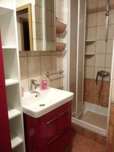 a bathroom with a sink and a shower at Apartments by the sea Petrcane, Zadar - 17179 in Petrcane +25 photos