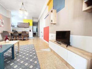 a living room with a flat screen tv on a counter at AS Monastiraki Apartment 1B in Athens