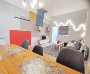 a living room with a table and a dining room at AS Monastiraki Apartment 1B in Athens
