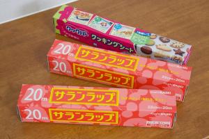 four boxes of donuts are sitting on a table at TOMMY CONDOMINIUM WAKASA 202 in Kume