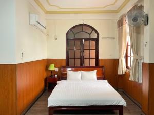Giường trong phòng chung tại Khách sạn Mekong Star