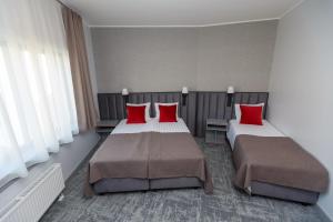 Postel nebo postele na pokoji v ubytování Tõrva Veemõnula Spaahotell