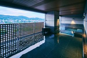 a swimming pool on the top of a building at Sora Niwa Terrace Kyoto Bettei in Kyoto