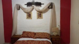 Ein Bett oder Betten in einem Zimmer der Unterkunft Hotel Posada de la Conspiración