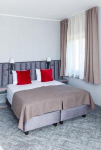 Postel nebo postele na pokoji v ubytování Tõrva Veemõnula Spaahotell